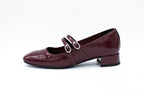 Decolleté in vernice con due cinturini bordeaux