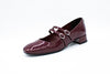 Decolleté in vernice con due cinturini bordeaux