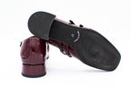 Decolleté in vernice con due cinturini bordeaux