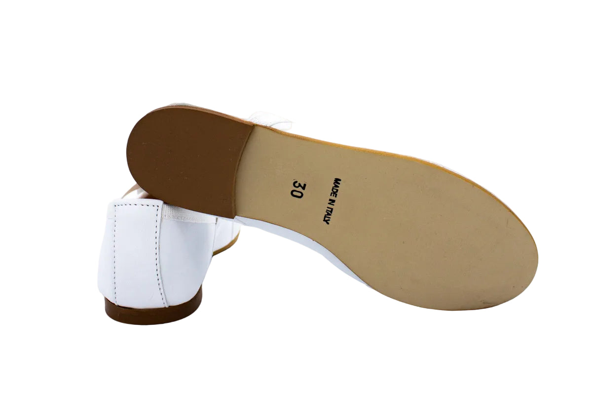 White leather ballet flats with crossed elastics