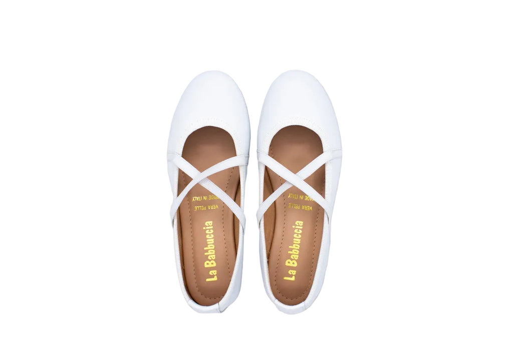 White leather ballet flats with crossed elastics